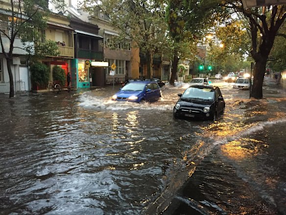 Crown Street, Surry Hills completely flooded after heavy rain overnight.