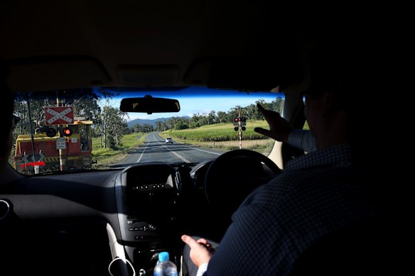 Mr Christensen stops for a sugar cane locomotive near Mackay.
