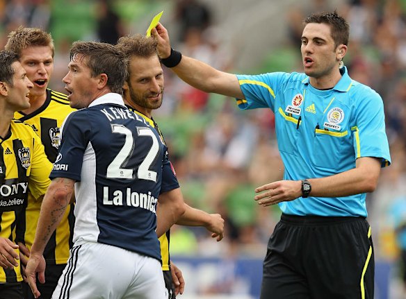 Harry Kewell of the Victory reacts after being given a yellow card during the round 11 A-League match between the Melbourne Victory and the Wellington Phoenix at AAMI Park on December 18, 2011 in Melbourne, Australia.