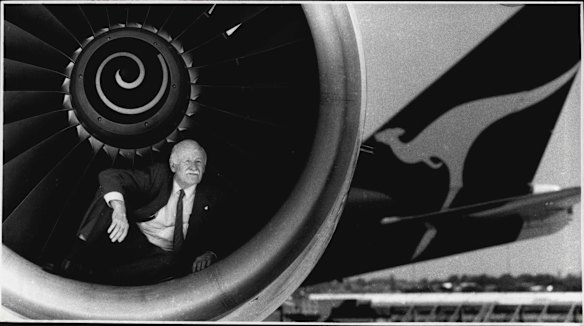 Captain Len Grey, who started flying with Qantas in 1936, poses inside the engine of a 747 in 1990.