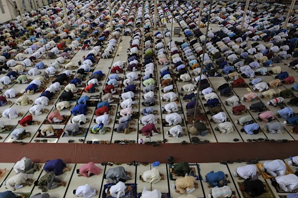 Muslims offer prayers on the morning of Eid-ul-Adha at Baitul Mukarram National Mosque in Dhaka, Bangladesh.