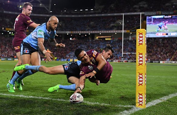 Valentine Holmes of the Queensland Maroons crosses over before the try was deemed a no-try.