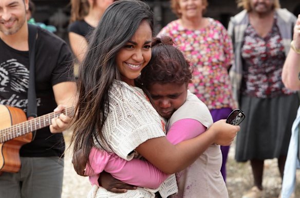 Jessica Mauboy hugs a young Aboriginal girl who was brought to tears when she joined Jessica Mauboy during her performance at Watson on The Nullabor Plain in South Australia for children from Oak Valley Aboriginal School. The concert in Watson is the highlight of many performances across Australia on the Indian Pacific Outback Christmas Train. 