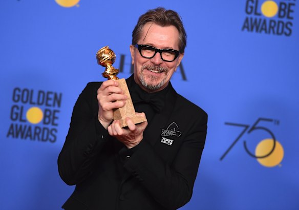 Gary Oldman with the Golden Globe for best actor in a motion picture (drama) for <i>Darkest Hour</i>.