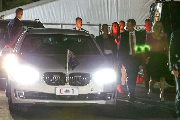 Opposition Leader Bill Shorten and wife Chloe walk past C1, the Prime Minister's car, as they depart after the Leaders' debate at the Windsor RSL. Friday 13th May.