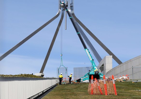 A security fence is installed across the lawns of Parliament House in Canberra on Tuesday.