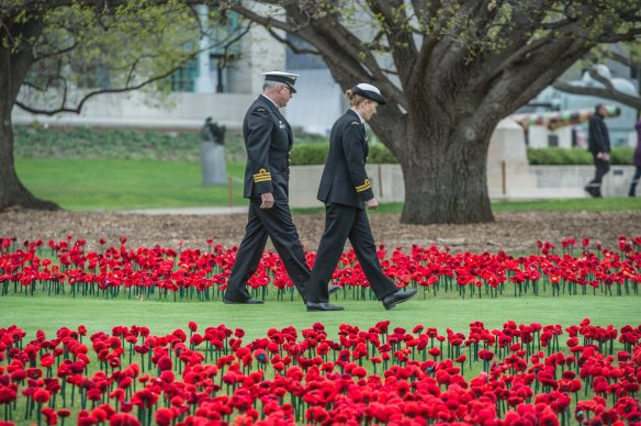 Installation of 62,000 hand-crafted poppies on the grounds of the Australian war memorial sculpture garden to mark the 62,000 Australians that have died in the service of their nation. Photo by Karleen Minney.