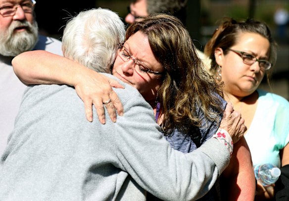 Friends and family are reunited with students after the shooting.