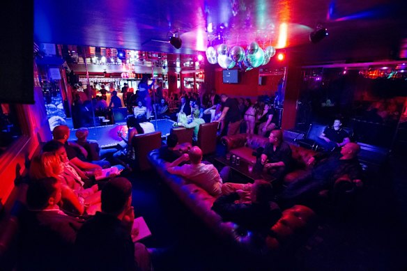 The first weekend of the new 1.30am lockout rules in Kings Cross. Dreamgirls strip club entertains its "locked in" patrons. 28th February 2014.