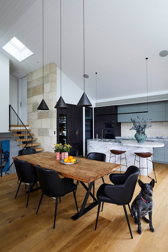 In the open-plan living space, “Cone” pendants by Urban Lighting hang over an
“Old Elm Hudson” table by MCM House and dining chairs by Voyager Interiors.