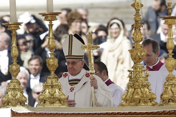 Pope Francis walks past the alter in front of St. Peter's Basilica at the Vatican.