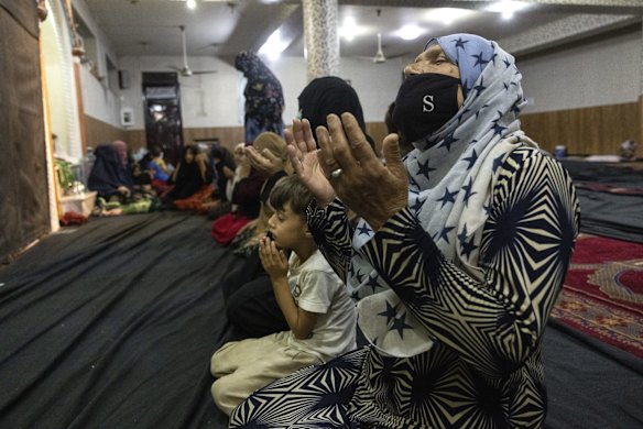 Displaced Afghan women and children from Kunduz pray at a mosque that is sheltering them on August 13, 2021 in Kabul, Afghanistan. Tensions are high as the Taliban advance on the capital city after taking Herat and the country's second-largest city Kandahar.