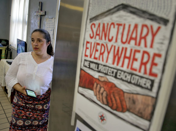 Joselaine, a migrant mother from Brazil, waits to speak at Annunciation House.