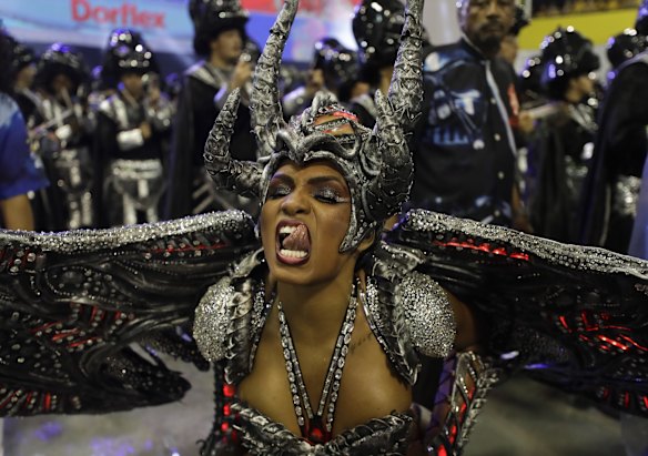 A dancer from the Imperio de Casa Verde samba school performs during a carnival parade in Sao Paulo, Brazil.