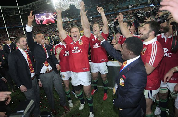 British and Irish Lions Jamie Rorberts holds up cup after winning the series.