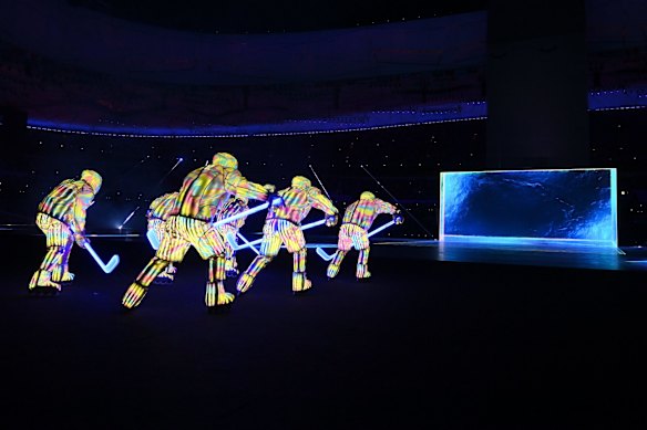 A projection display depicting ice hockey players is seen during the Opening Ceremony.