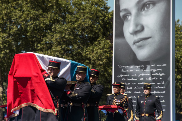 The flag-draped coffins of late holocaust survivor Simone Veil is carried by members of the French Republican Guard.
