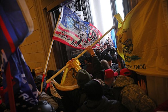 Pro-Trump protesters enter the US Capitol building during demonstrations in the nation's capital.
