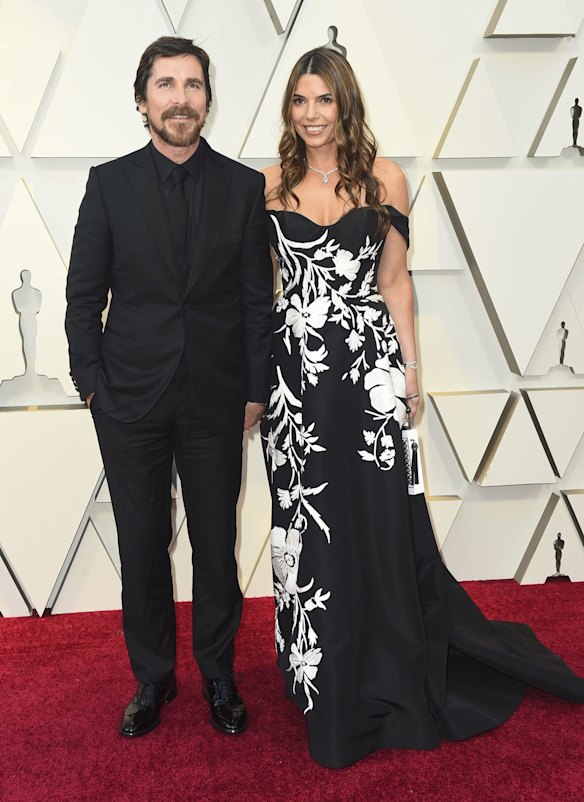 Christian Bale, left, and Sibi Blazic arrive at the Oscars at the Dolby Theatre in Los Angeles. 
