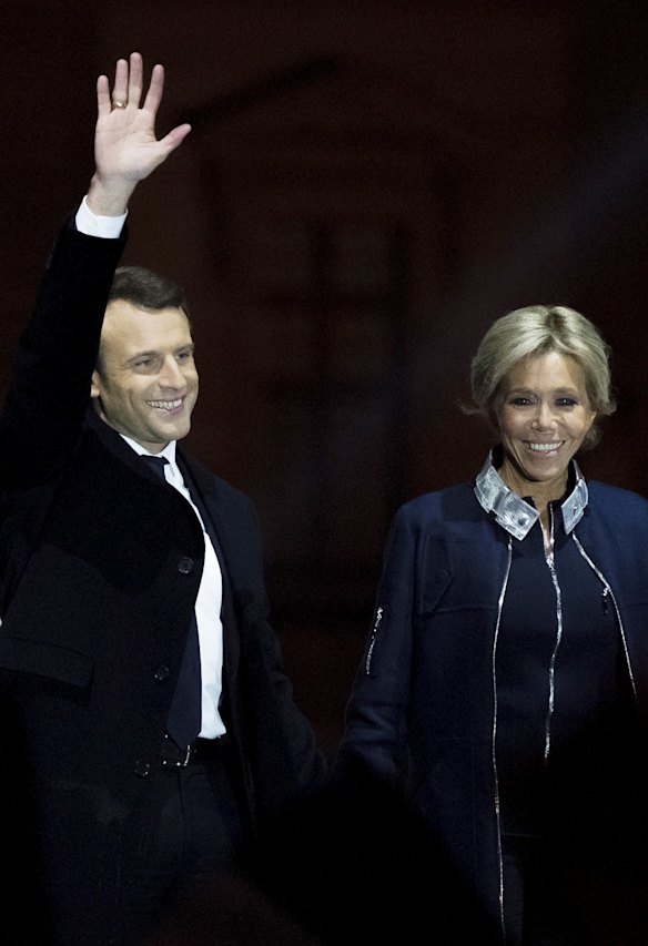 Leader of 'En Marche !' Emmanuel Macron waves to supporters with wife Brigitte after winning the French Presidential Election, at The Louvre on May 7, 2017 in Paris, France. Pro-EU centrist Macron is the next president of France after defeating far right rival Marine Le Pen by a comfortable margin, estimates indicate.