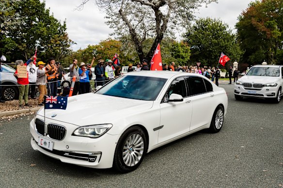 The Prime Minister's motorcade leaves Government House.