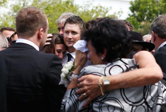 Michael Clarke consoles his wife Kyly during the Funeral Service for Phillip Hughes.