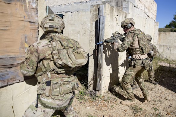 Prince Harry participates in a counter-terrorism exercise with the 2nd Commando Regiment. 

