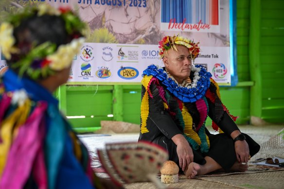 Tuvaluan Finance and Climate Change Minister Seve Paeniu is welcomed to the Kioa meeting in a traditional ceremony. 