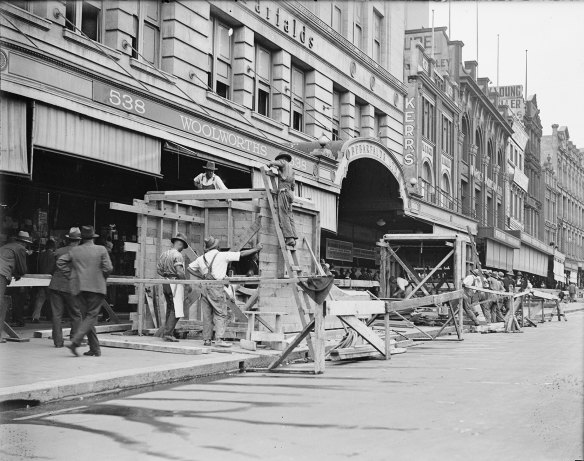 One of the entrances to Town Hall Station, in front of Bebarfalds store, during construction.