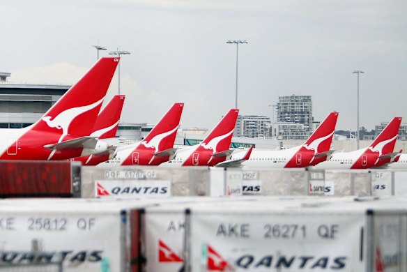 Qantas planes sit grounded at Sydney International Airport on October 30, 2011 a day after the country's national carrier grounded its entire fleet due to a bitter industrial row. Photo by AFP