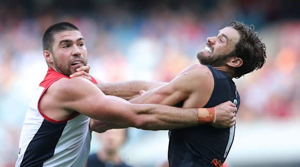 Chris Dawes and Andrew Walker battle for a mark.