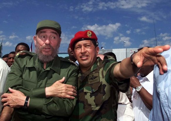 In this Oct. 28, 2000 file photo, Cuba's President Fidel Castro, left, talks with Venezuela's President Hugo Chavez in Barinas, Venezuela, near Chavez's hometown of Sabaneta.