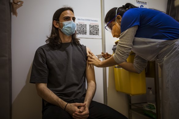 Alex Sartor receiving a Pfizer vaccination at the Melbourne Showgrounds clinic on Wednesday. 