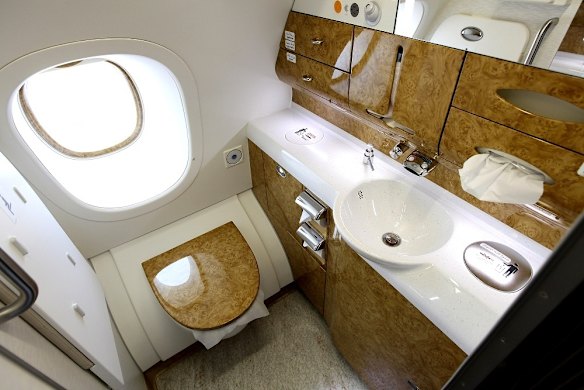 Glossy wood decorates a bathroom in the business class section of an Emirates Airbus A380.