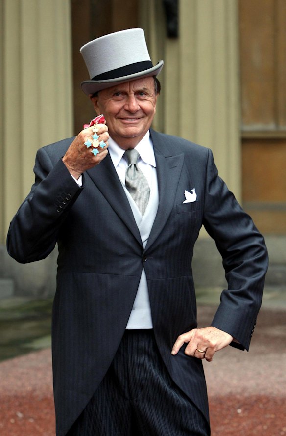 Australian entertainer Barry Humphries poses for pictures after he received his Most Excellent Order of the British Empire from Britain's Queen Elizabeth II at Buckingham Palace, London, in 2007. 
