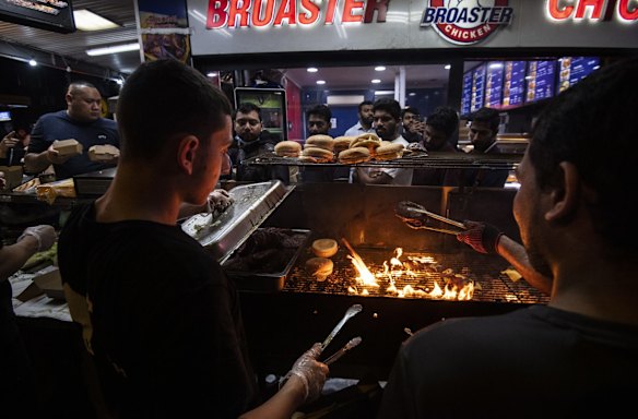 Muslims break their daily fast during the month of Ramadan by visiting food stalls in the evening along Haldon Street, Lakemba.