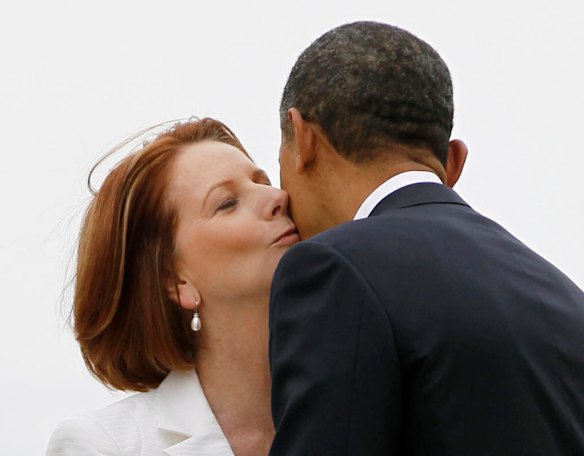 U.S. President Barack Obama is welcomed by Australia's Prime Minister Julia Gillard after arriving in Canberra, Australia.