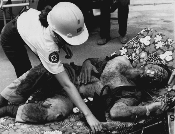 “It was a bloody mess.” A paramedic attends to an injured worker.