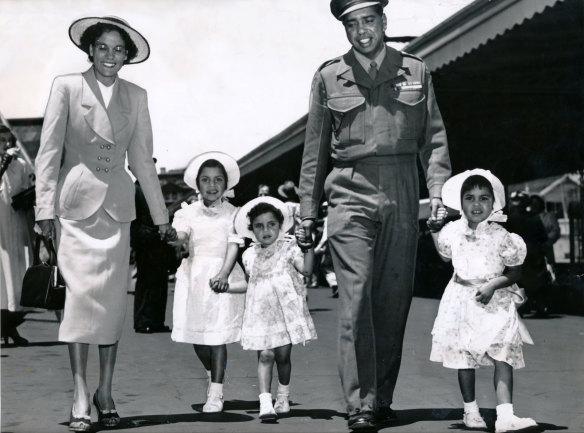 Reg Saunders with his family at Spencer Street Station after arriving back in Australia from Korea. 