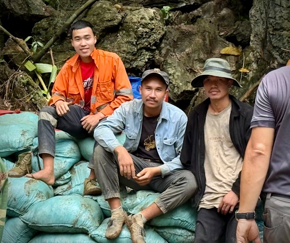 Scores of people, many of them volunteers, traverse the treacherous track to the cave each day to offer help. 