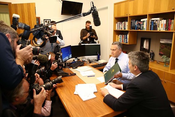 Treasurer Joe Hockey and Finance Minister Senator Mathias Cormann pose for the media in the Treasurer's office on Budget Day.