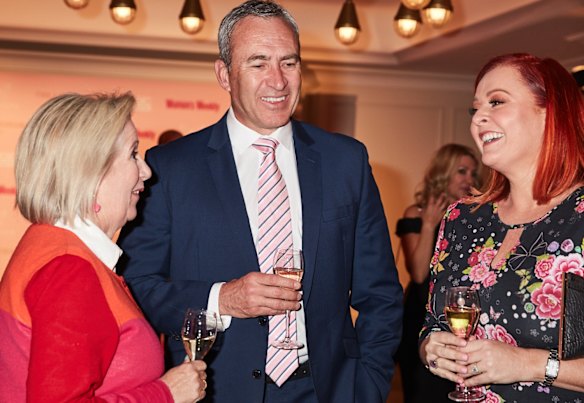 Channel 7 sports journalist Mark Beretta sipping champagne with social commentator Jane Caro (L) and TV regular Shelly Horton (R) at the Pink Hope launch.