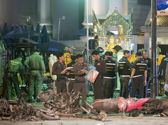 Police investigate the scene at the Erawan Shrine after an explosion in Bangkok,Thailand, Monday, Aug. 17, 2015. A large explosion rocked a central Bangkok intersection during the evening rush hour, killing a number of people and injuring others, police said.