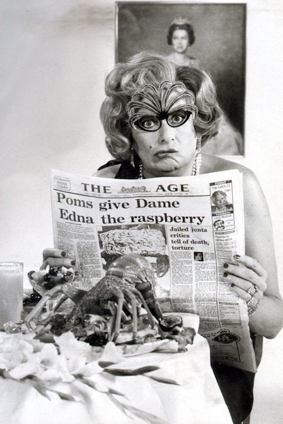 Barry Humphries performing as Dame Edna Everage reading The Age newspaper with headline 'Poms give Dame Edna the raspberry', 23 March 1981.