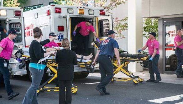 A patient is wheeled into the emergency room at Mercy Medical Centre in Roseburg, Oregon, following a deadly shooting at Umpqua Community College.