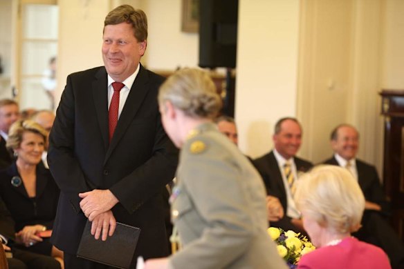 Senator David Johnston smiles as he was almost wrongly sworn in before correctly sworn in as  Defence minister by Governor-General Quentin Bryce at Government House in Canberra.