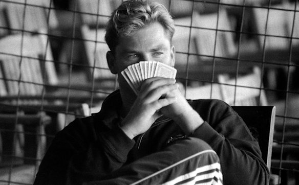A game of cards during a tour match in Colombo in September 1999.