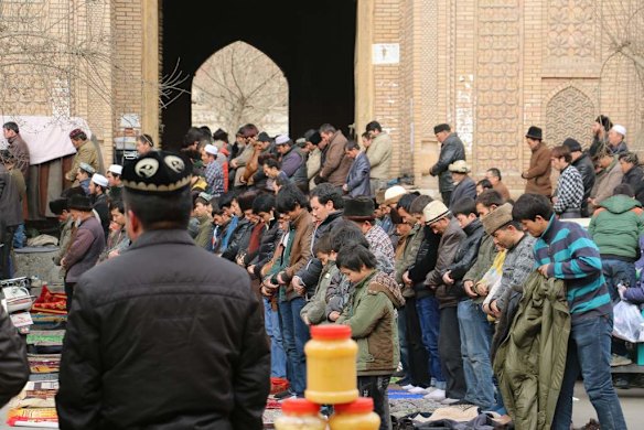 Worshippers at Friday prayers, at the central mosque in Hotan.