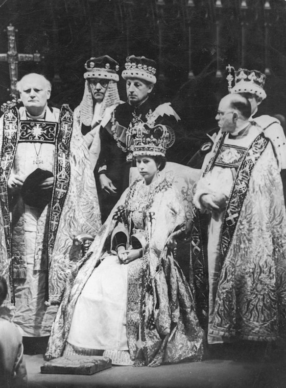 Queen Elizabeth II prepares to receive Homage after her coronation ceremony in Westminster Abbey, London, 2nd June 1953. Michael Ramsey (1904 - 1988), the Bishop of Durham, is on the left, and Harold William Bradfield (1898 - 1960), the Bishop of Bath and Wells, is on the right. (Photo by Keystone/Hulton Archive/Getty Images)