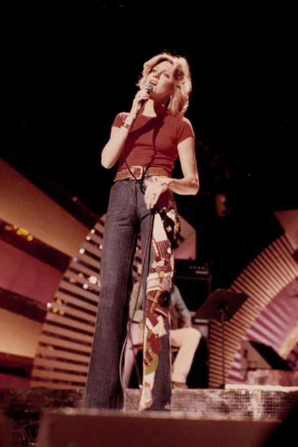 Olivia Newton-John performs "Have You Never Been Mellow" on the NBC television show The Midnight Special circa 1975 wearing custom bellbottom jeans designed by Fleur.